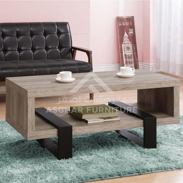 A light wooden rectangular coffee table with an open shelf, supported by black metal legs.
