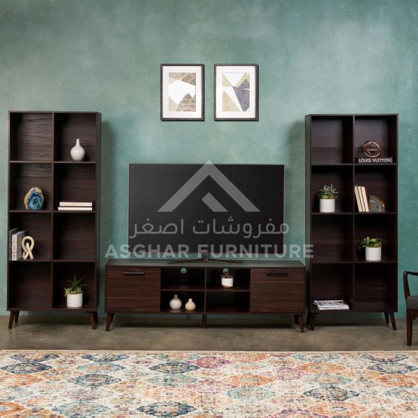 A TV stand and two cube bookcases in a dark wood finish, and two abstract art prints on the wall.