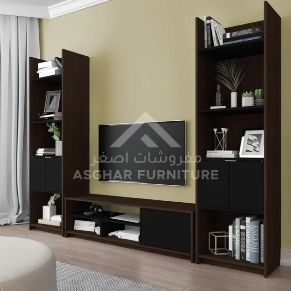 A wide wooden TV wall unit with a TV mounted on a wooden back panel, two large bookcases, and black cabinets.