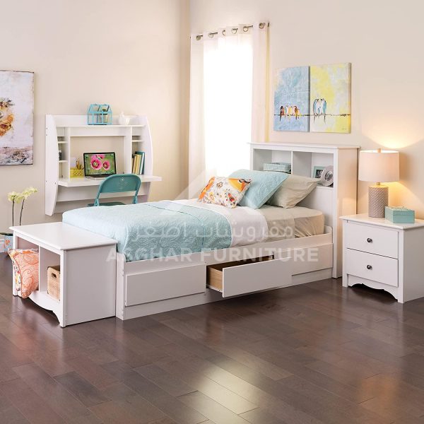 A child's white wooden bed with storage drawers, a pull-out desk, and a matching nightstand.