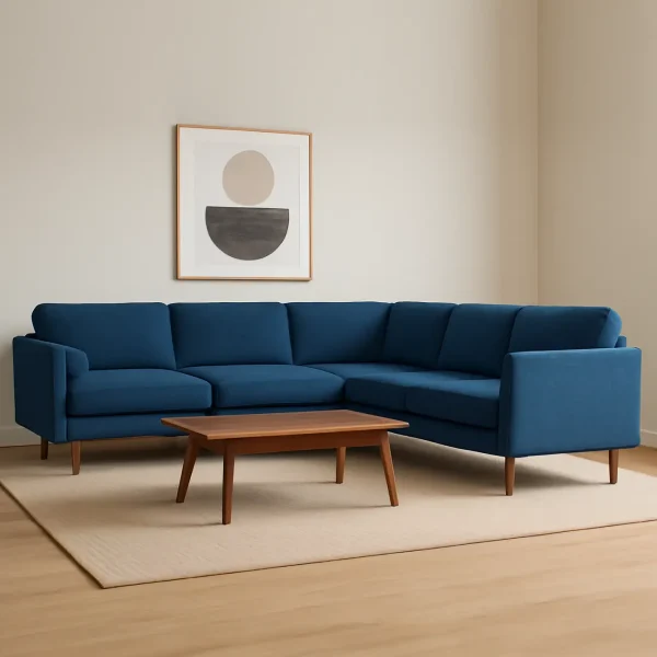 A bright blue corner sectional sofa with a low wooden coffee table on a neutral rug. An abstract art print hangs above it.