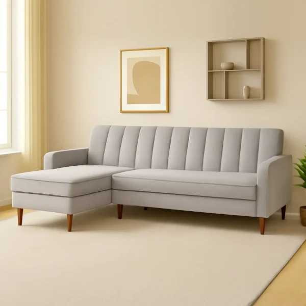 A sleek light gray L-shaped sectional sofa with vertical channel tufting and a left-hand chaise lounge.