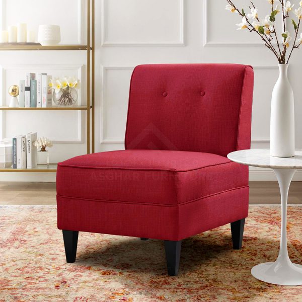 A cherry red tufted slipper chair with a high back and dark wooden splayed legs.