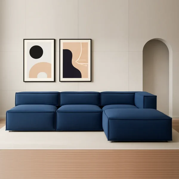 A navy blue modular sectional sofa with a chaise lounge. The sofa has a streamlined design with clean lines and low-profile block legs.