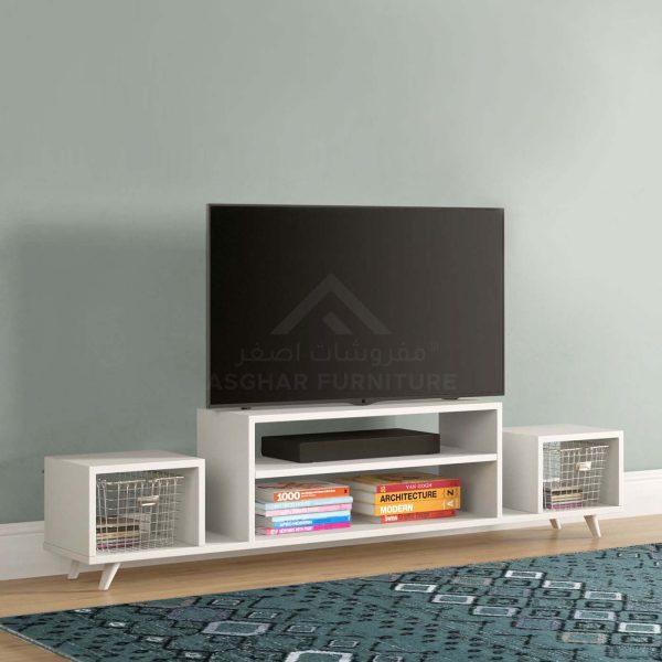 A minimalist white TV stand with open shelves and two side compartments with wire baskets.