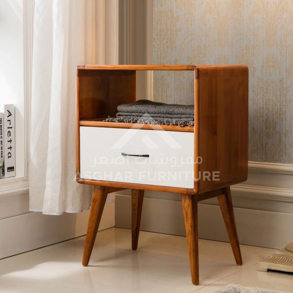 A mid-century modern two-tone nightstand with a white drawer, an open shelf, and splayed legs.
