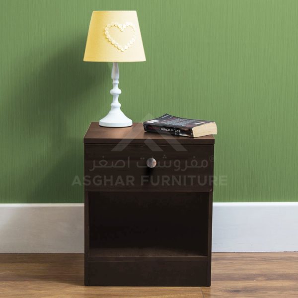 A simple dark wood nightstand with one drawer, an open shelf, and a heart-patterned lamp.