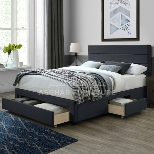 A stylish charcoal gray bed with a paneled headboard and convenient under-bed storage drawers.