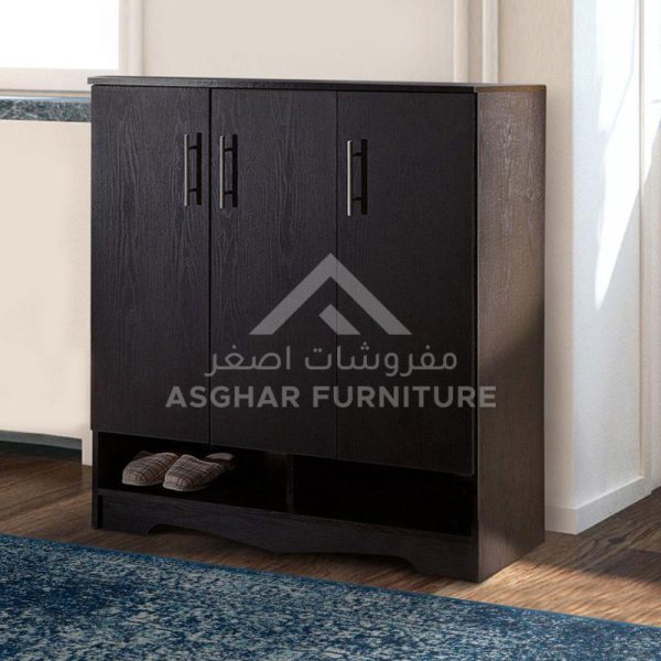 A dark wood shoe cabinet with three doors, black handles, and two open bottom shelves for footwear.
