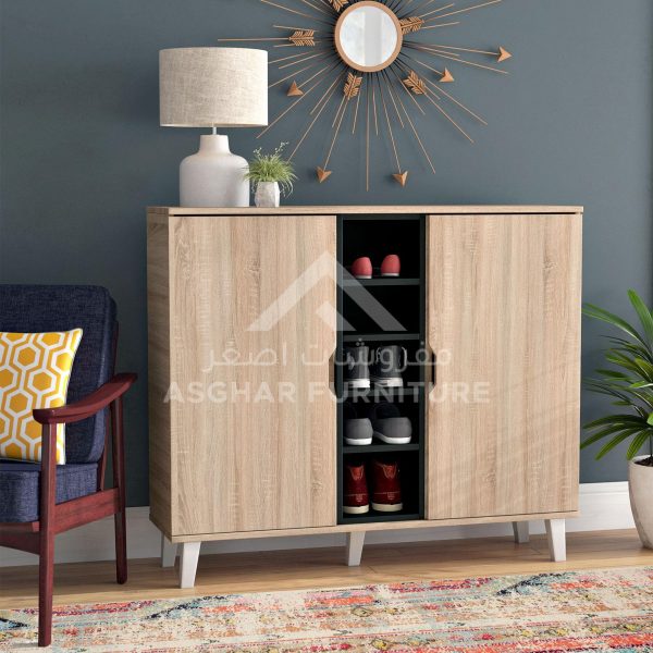 A contemporary light wood shoe cabinet with two doors, a central open section, and splayed white legs.