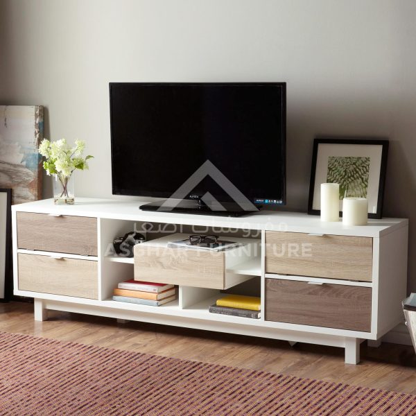 A large white and wood TV unit with a television, open shelves, and four drawers in a living room.
