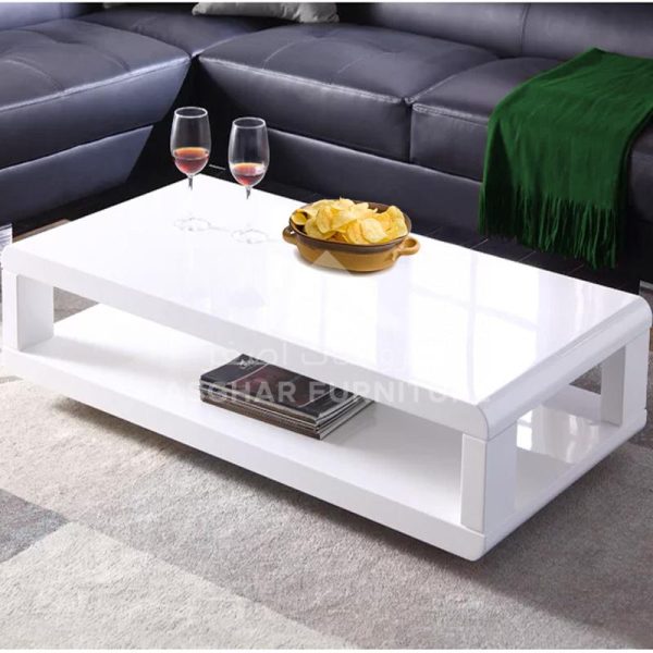 A rectangular white high-gloss coffee table with an open lower shelf.