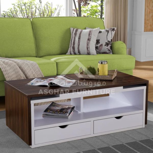 A rectangular coffee table with a dark wooden top, white drawers, and open shelving.