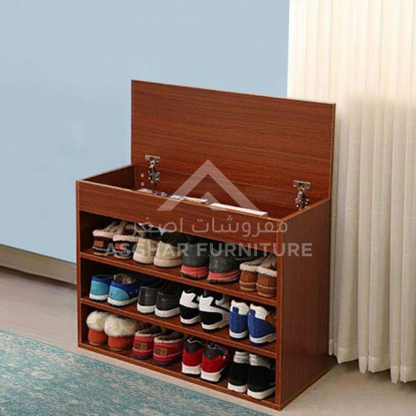 A reddish-brown wooden shoe rack with three open shelves and a hinged top compartment, filled with various shoes.