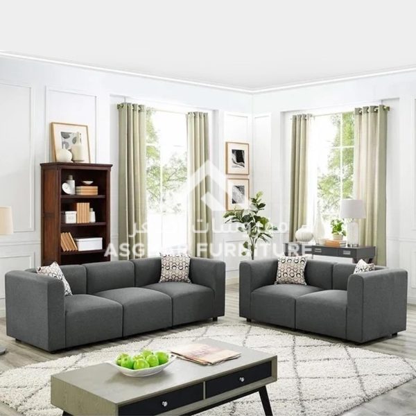 A gray living room set with a three-seater and a two-seater sofa with decorative pillows.