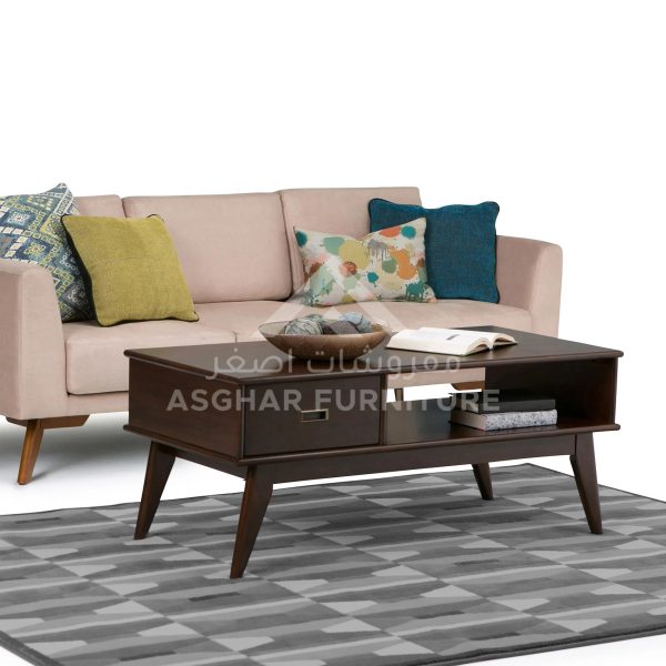 A contemporary dark wooden coffee table with a drawer and an open shelf, supported by angled legs.