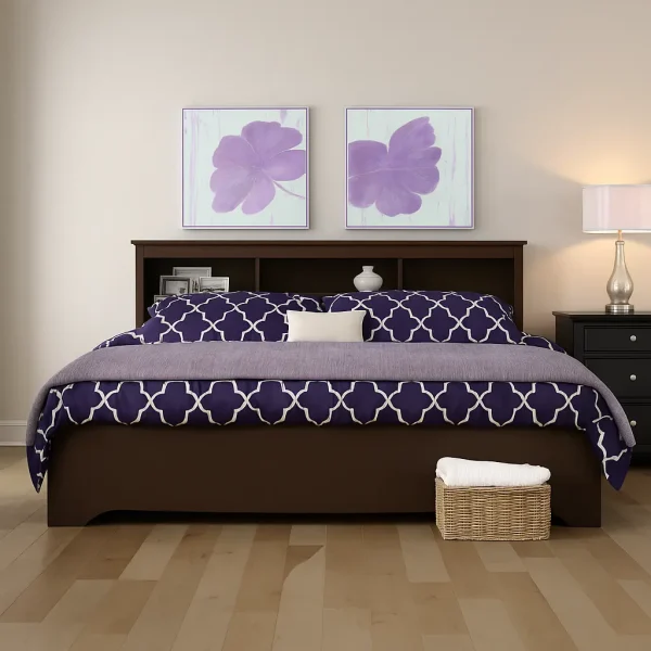 A wooden platform bed with a dark brown finish and a built-in bookshelf headboard.