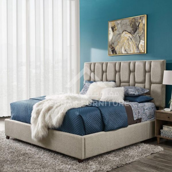 A plush bed with a tufted headboard, blue bedding, and a white fluffy throw in a modern bedroom.