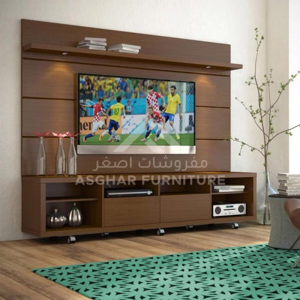 A wooden floating media console with a TV mounted on a back panel, a shelf for display, and a TV stand with drawers and open shelves on wheels.