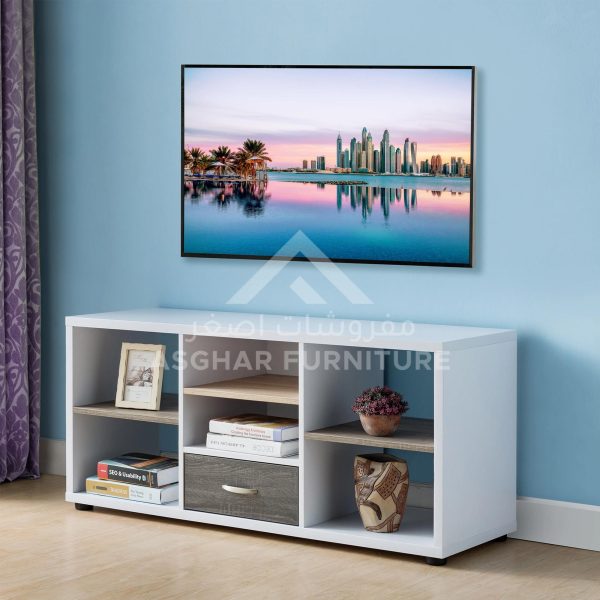A white and gray wooden TV stand with a mix of open shelves and a small drawer.