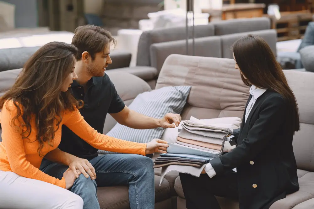 couple choosing fabric for furniture
