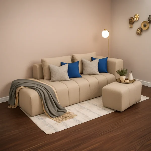A contemporary beige modular sofa with channel tufting and a matching ottoman.