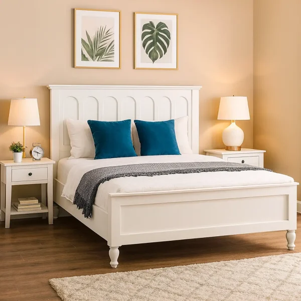 A traditional white wooden bed frame with a paneled headboard, flanked by two nightstands and lamps.