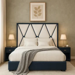 A stylish bedroom featuring a navy blue bed with a decorative white and navy headboard and nightstands.