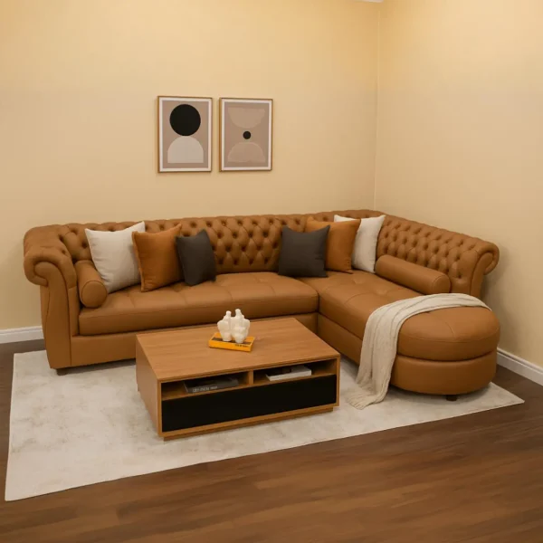 A tan tufted L-shaped sectional sofa with a round chaise and a square coffee table with a black drawer.