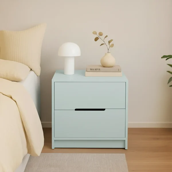 A minimalist two-drawer nightstand in a soft light blue color, with a mushroom lamp and books on top.