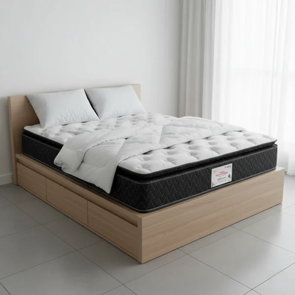 A light wood platform bed with drawers holds a black mattress with a pillow top and white quilting.