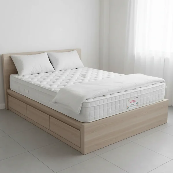 A quilted white mattress with a tufted surface sits on a light wood platform storage bed frame.