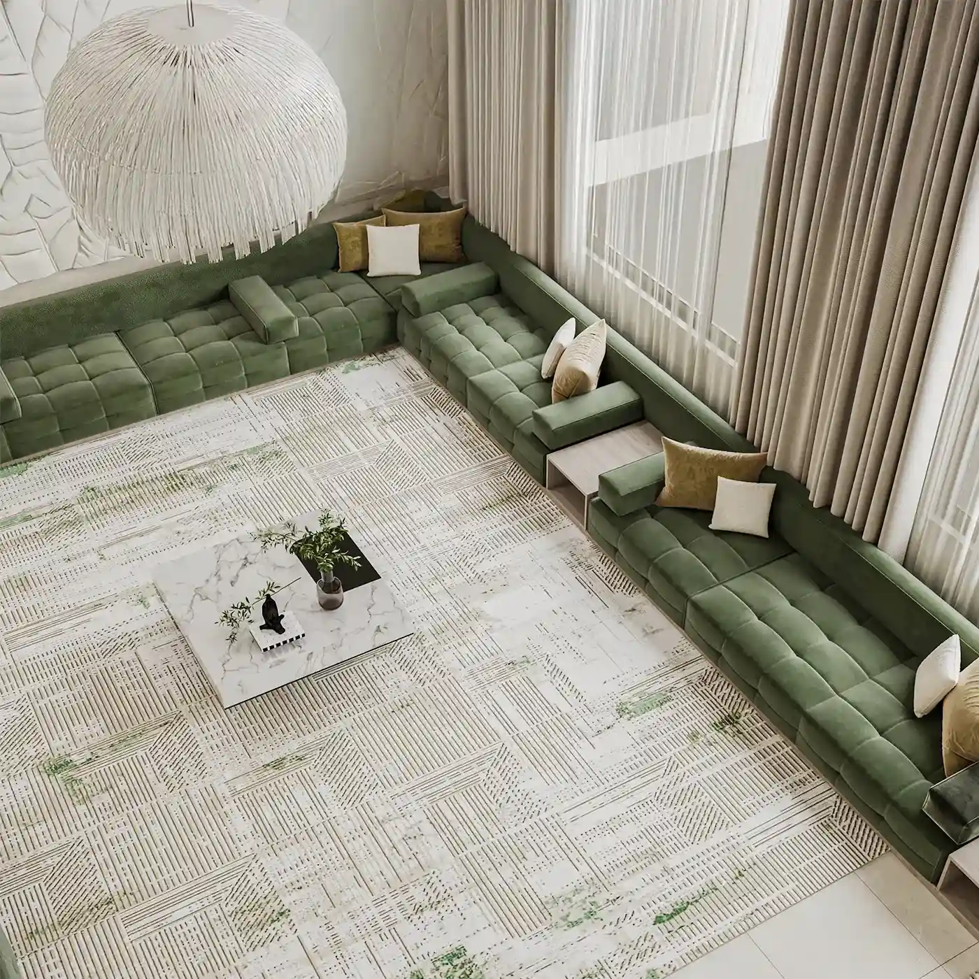 A spacious living room from above, featuring a large green sectional sofa and a marble table.