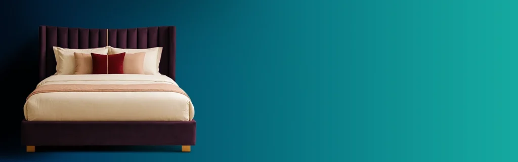 A plush, deep purple bed with a tall, ribbed headboard and pillows is shown against a teal background.